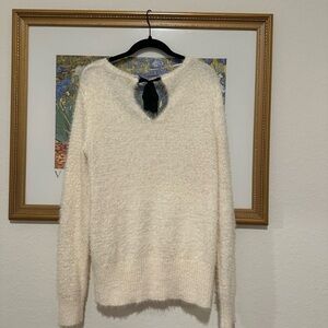 White sweater with bow